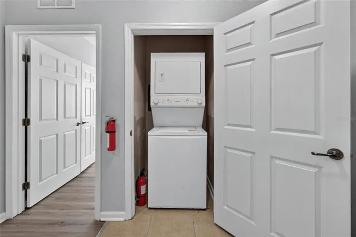 WASHER/DRYER CLOSET. Primary bedroom (left).