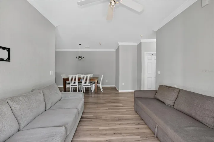 LIVING ROOM, facing dining space. Second and third bedrooms directly to the right. Shared hall bath (door shown right)