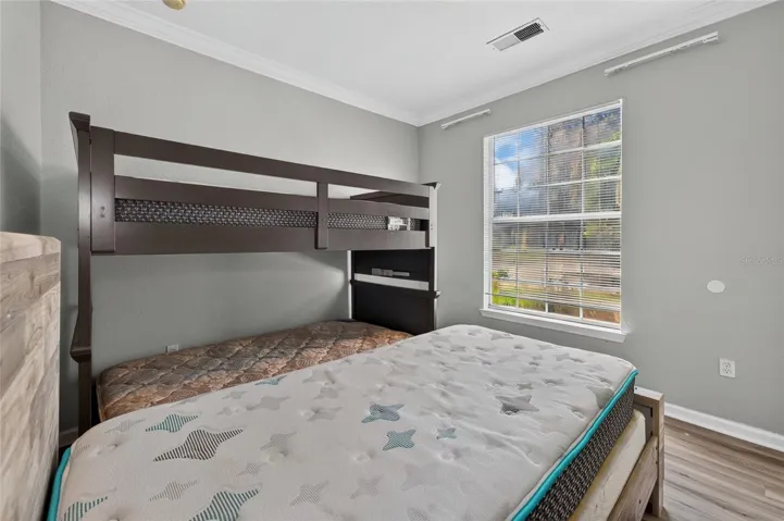 2ND BEDROOM. Directly behind living room. Shared full bath directly across the hall. SW facing light.