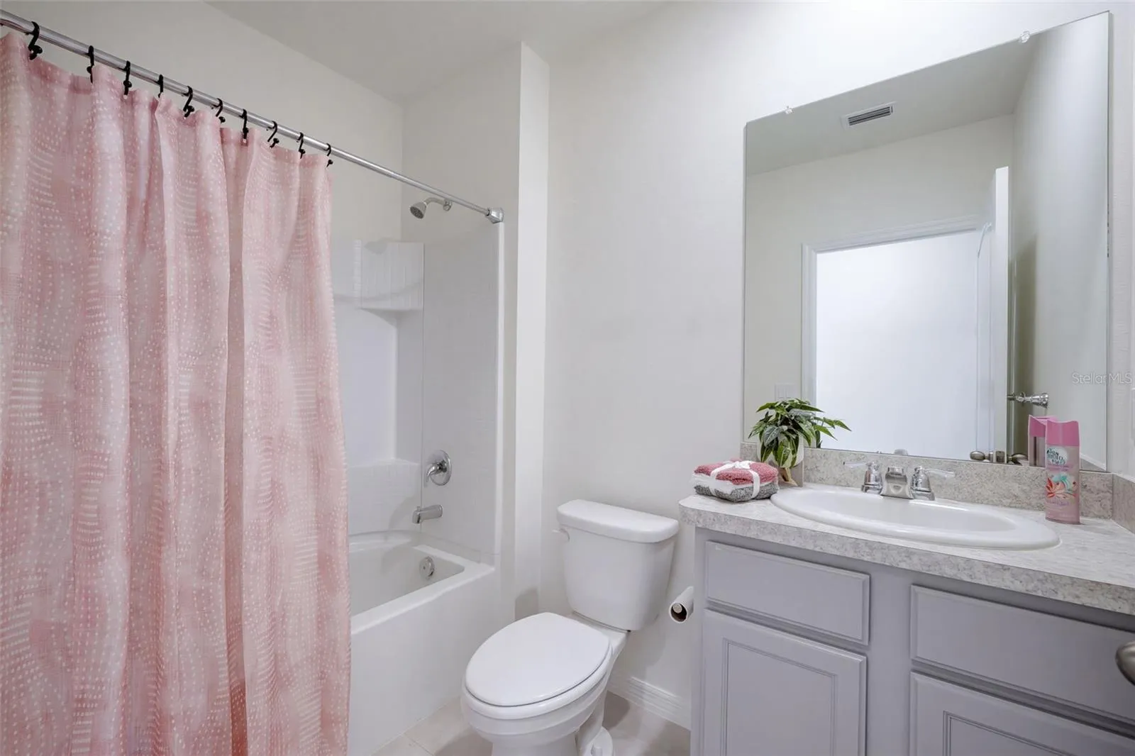 Guest Bathroom features a comfort height vanity with tub/shower unit