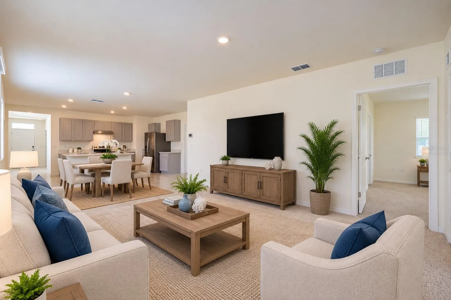 Virtually Staged, The spacious living room offers high ceilings and a glass sliding door leading to the Florida room