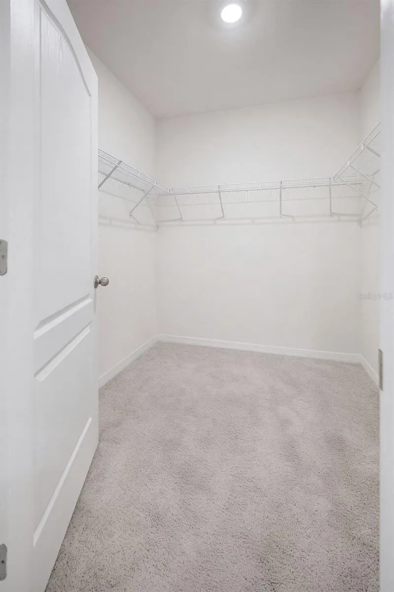 Primary Bedroom offers a Walk-in Closet