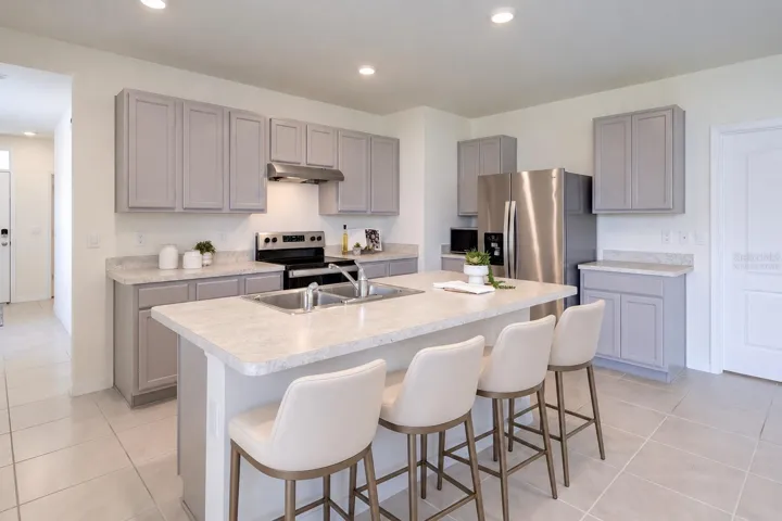 Virtually Staged, Eat-in Kitchen features Grey Cabinetry