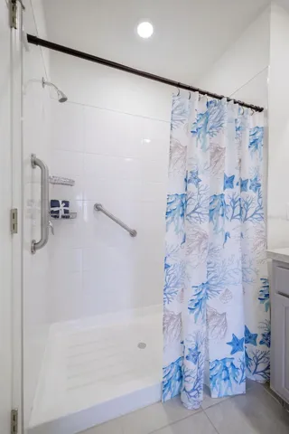 Walk-in shower with safety grab bars