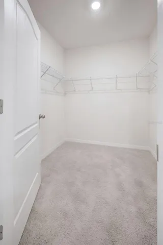 Primary Bedroom offers a Walk-in Closet