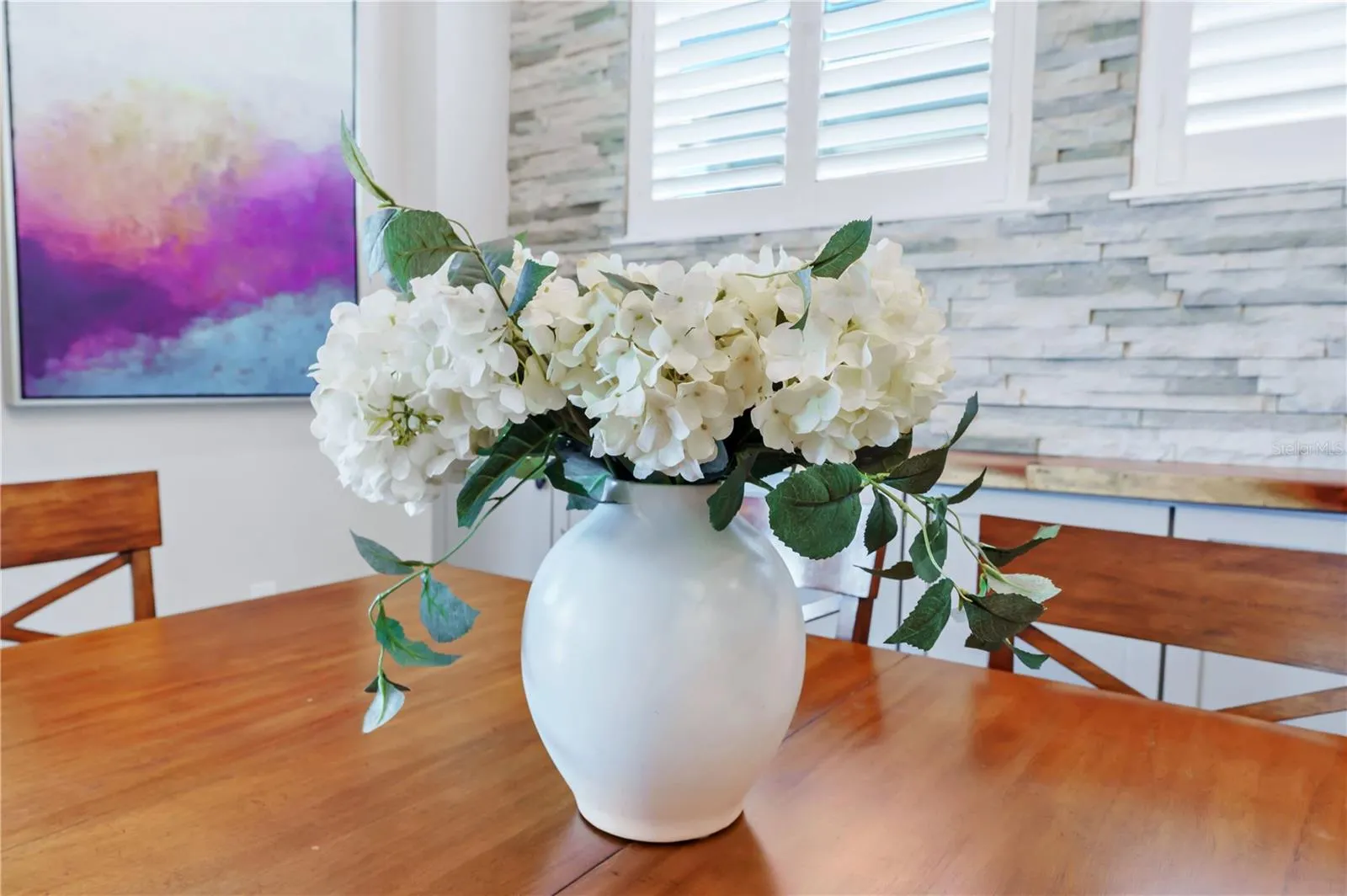 Thoughtful finishes and natural light create a warm, welcoming dining space.