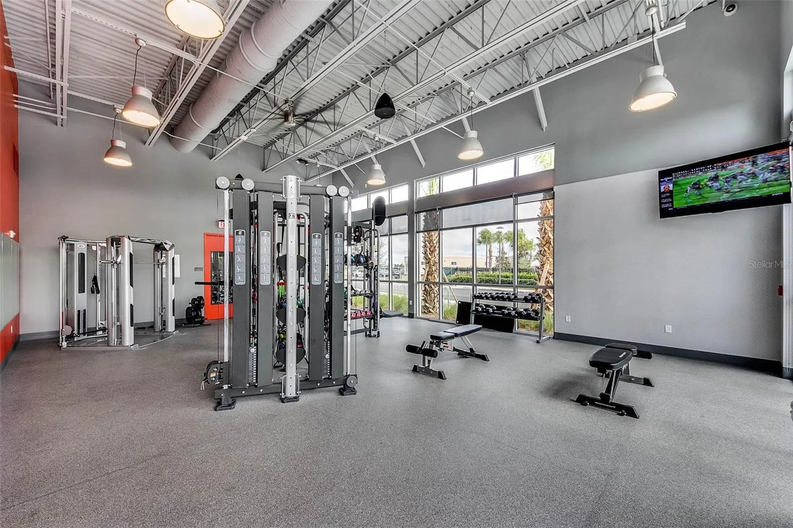 Community fitness center with strength training equipment and modern design.