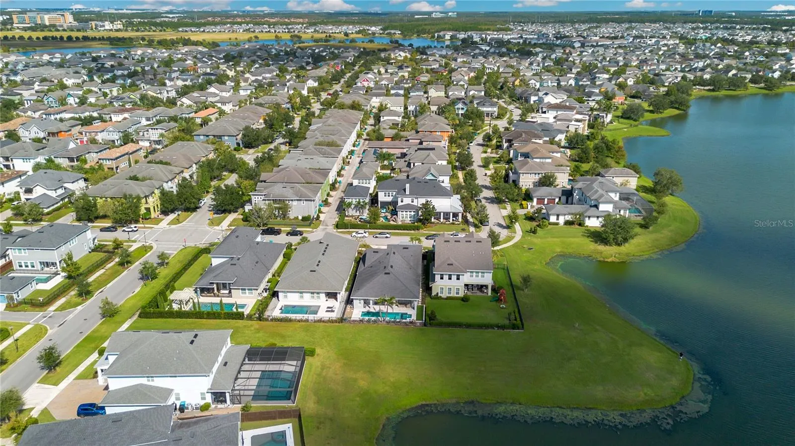 Laureate Park community aerial with community pool, fitness center, dog parks, pickleball, and tennis nearby.
