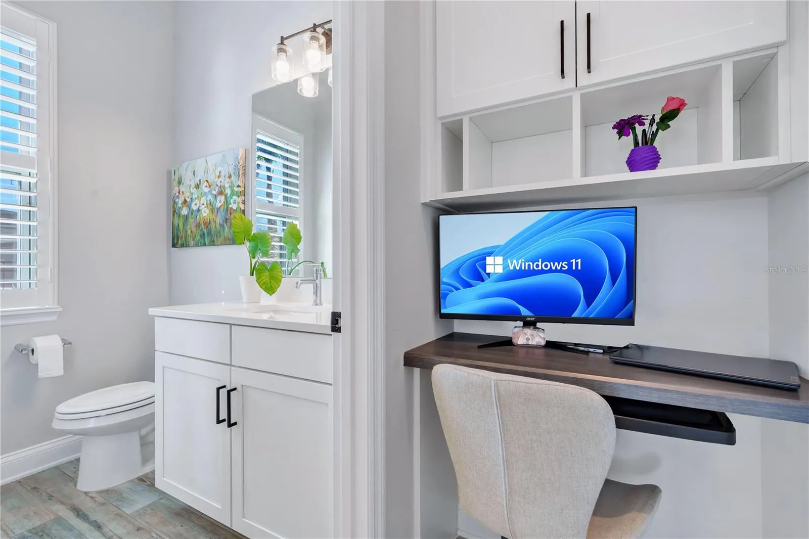 Built in office nook with desk and shelving, a functional workspace for working from home.