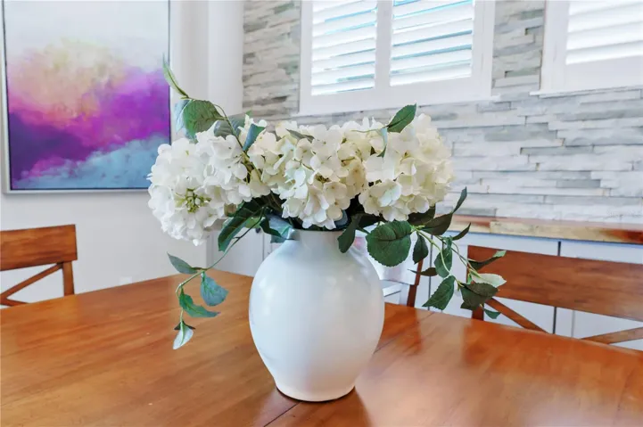 Thoughtful finishes and natural light create a warm, welcoming dining space.