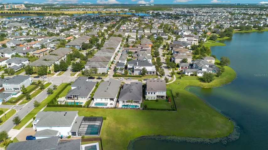 Laureate Park community aerial with community pool, fitness center, dog parks, pickleball, and tennis nearby.