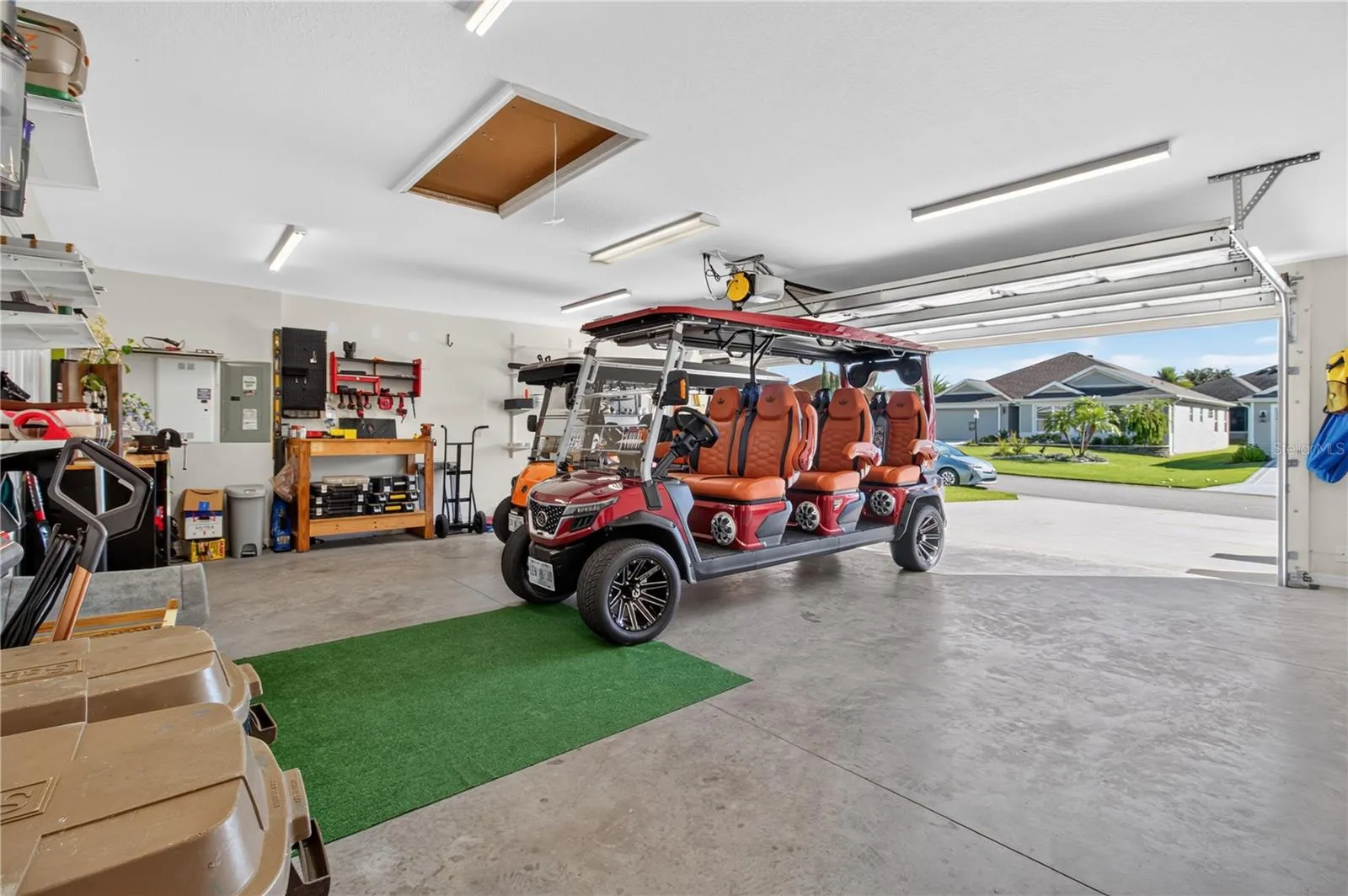 Garage is nearly te same size as a  car plus Golf car garage
