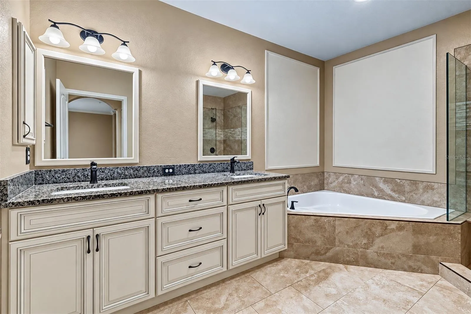 Second floor bathroom with double vanity, granite tops, dual sinks and garden tub