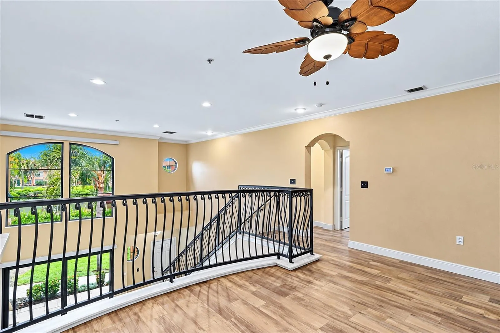 Loft with access to hallway to 2nd floor primary bedroom and bath