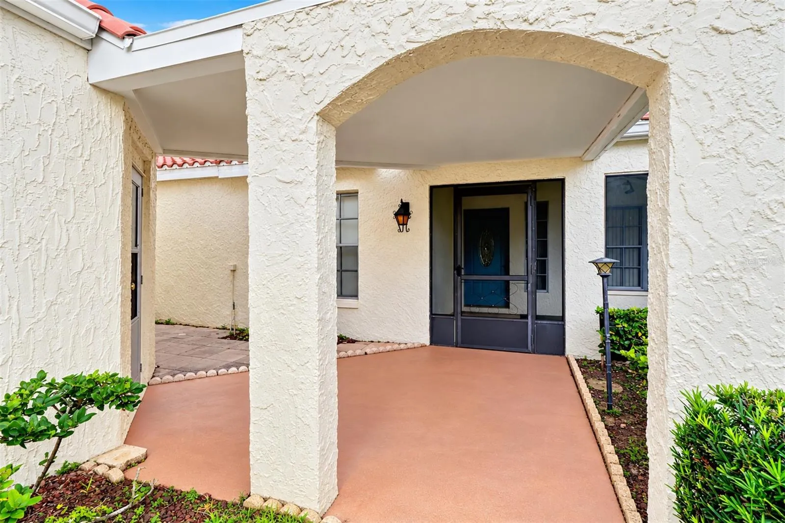 Covered breezeway area from garage and covered entry