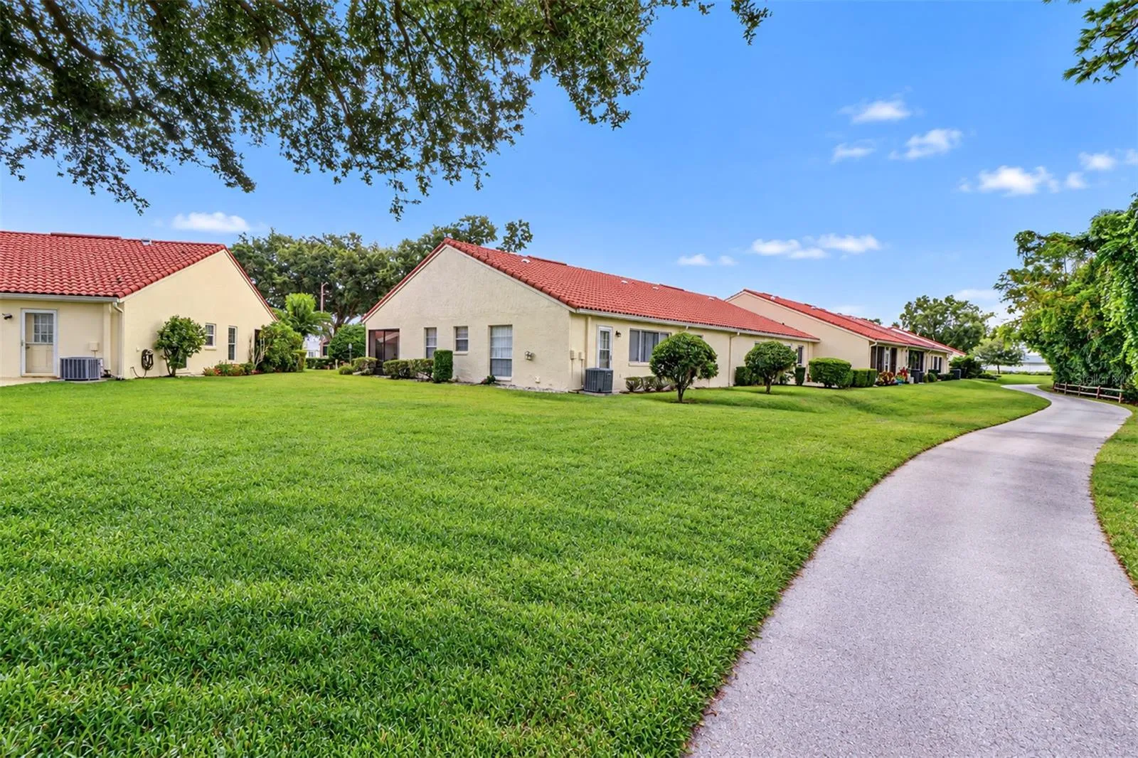 View from the adjacent golf tee looking back at the villa and golf cart path