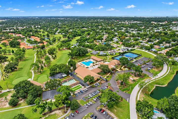 Aerial showing the massive Highland Lakes clubhouse and outside recreational facilities