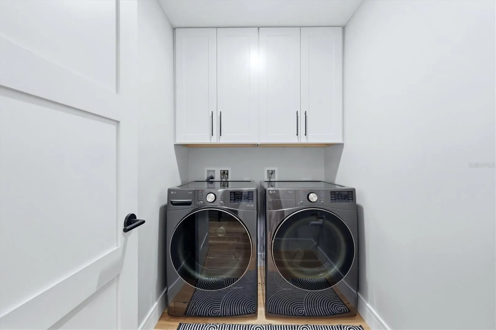 Laundry Room with storage cabinets