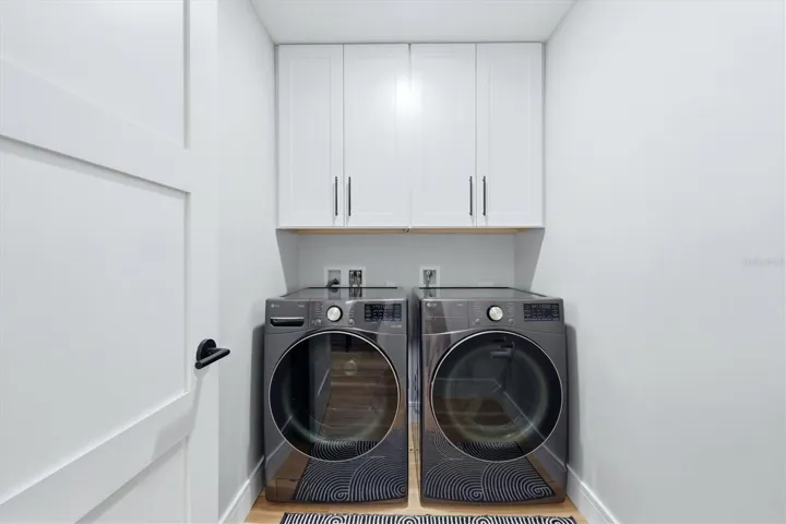 Laundry Room with storage cabinets
