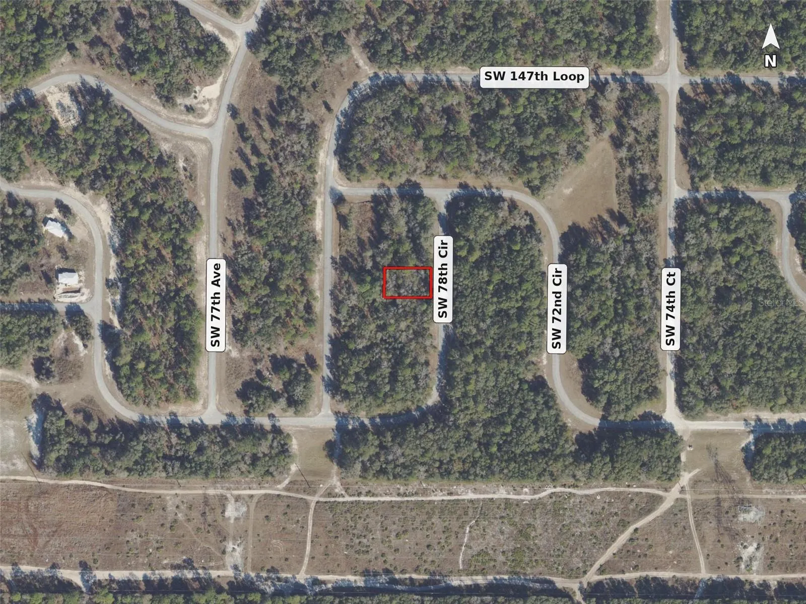 Neighborhood aerial, lot outlined in red