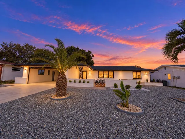 Front of house with virtual twilight