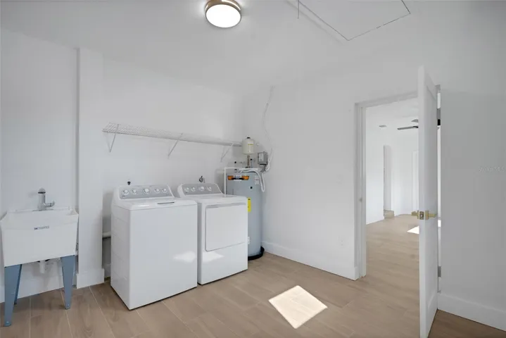 laundry room with washer and dryer included