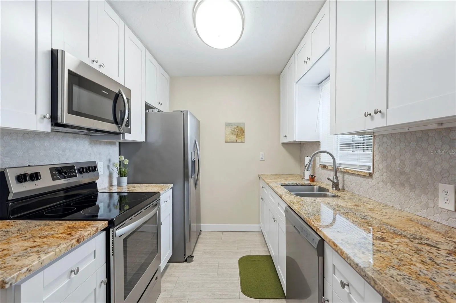 Granite Counters, Shaker Cabinets, Tile Backsplash