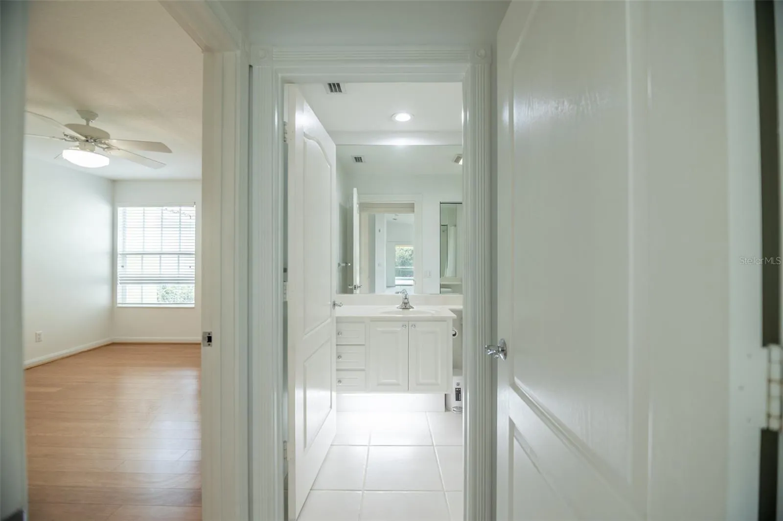 Ensuite guest bath with a tub.