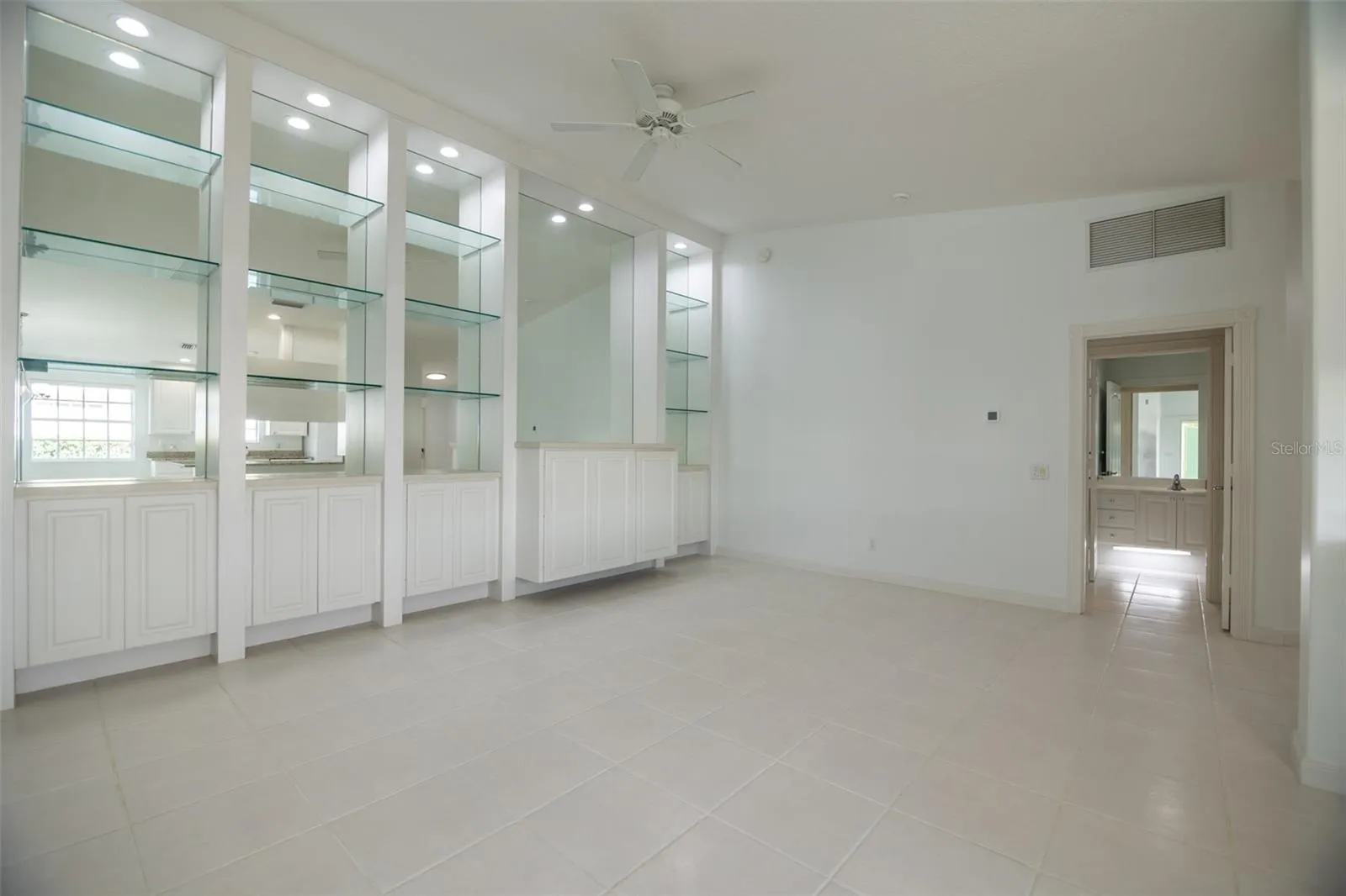 Formal living room with view of guest bathroom.