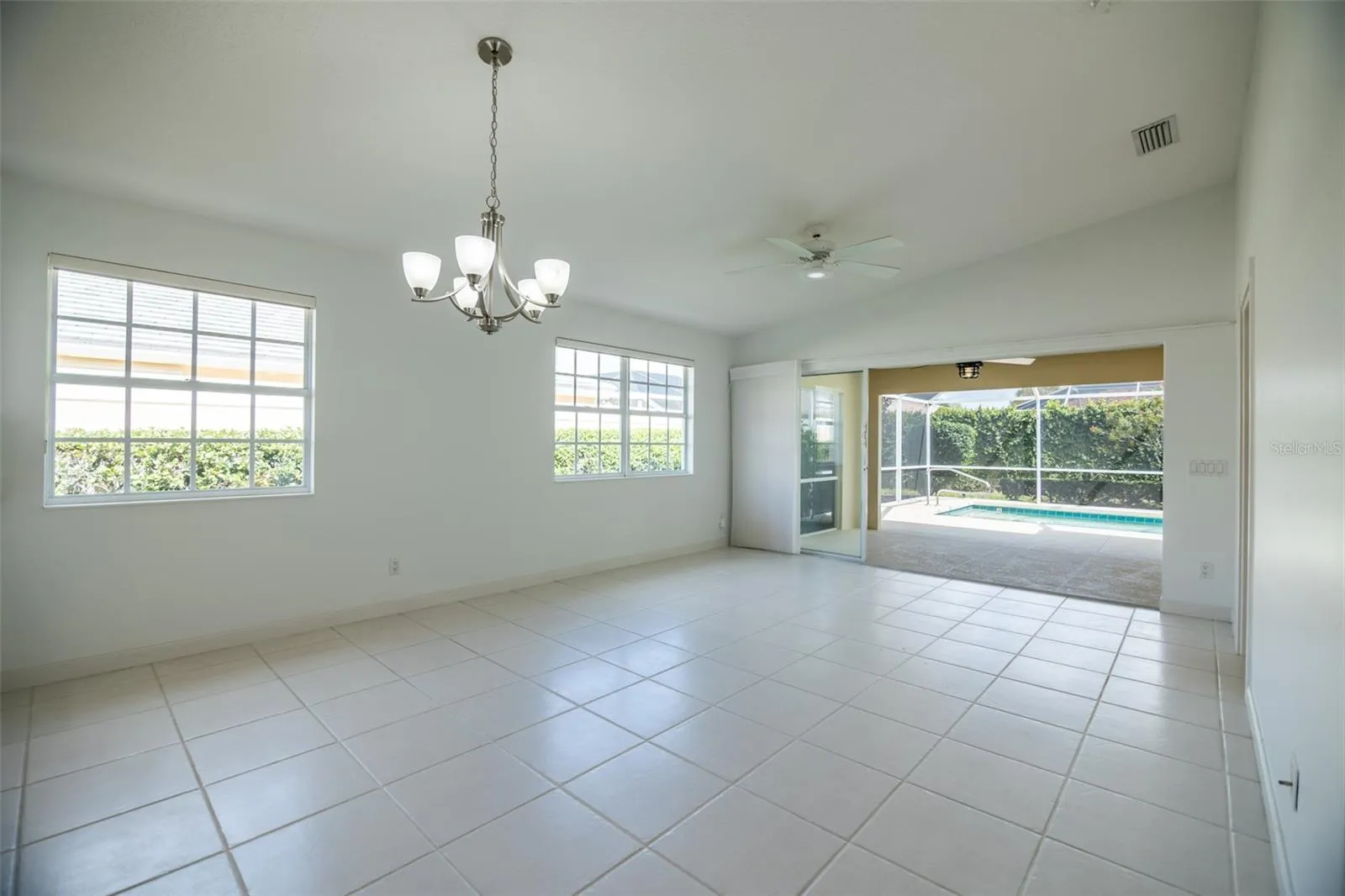Dining and or living room with views to the pool.