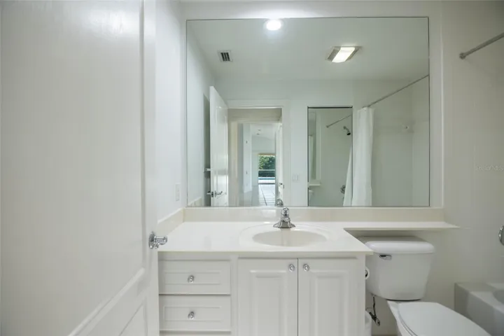 Ensuite guest bath with a tub.