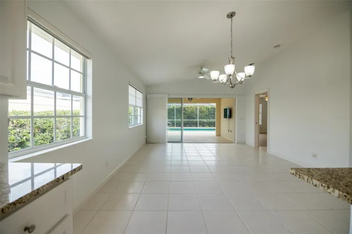 Dining and or living room with views to the pool.