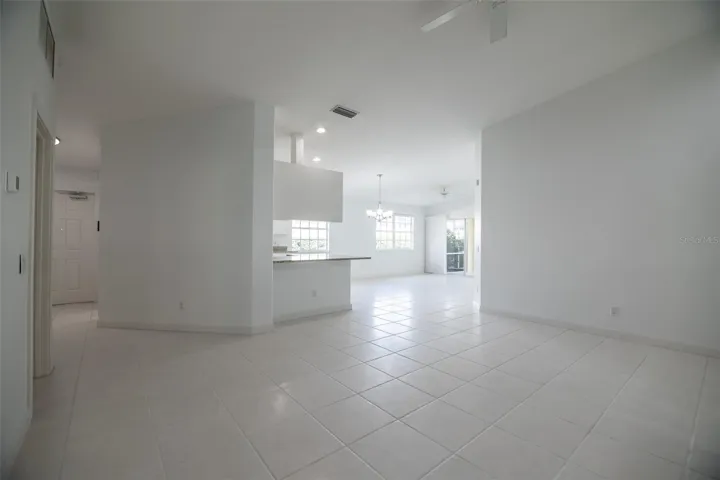 Formal living room looking towards the kitchen and entrance.