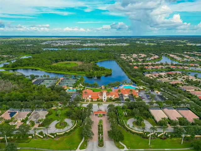 Front on sky view of neighborhood and recreational facilities.