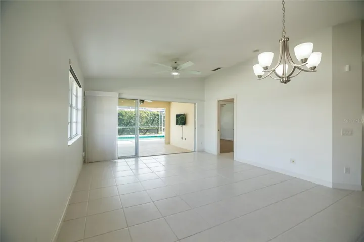 Dining and or living room with views to the pool and primary suite.