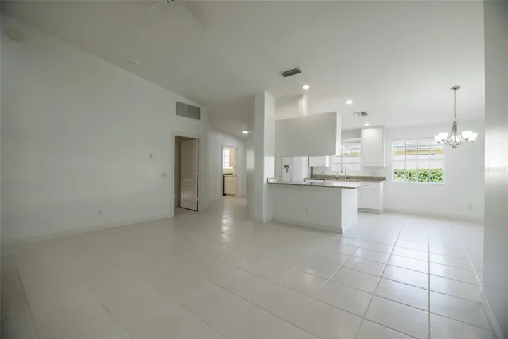 Formal living room looking towards the kitchen and entrance.