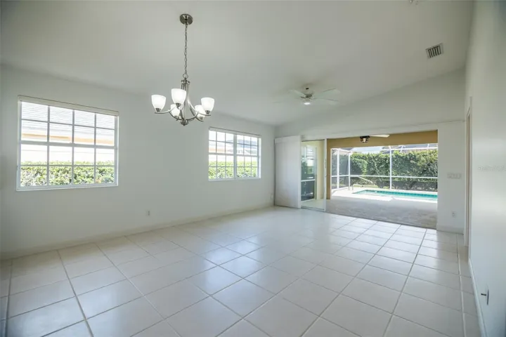 Dining and or living room with views to the pool.