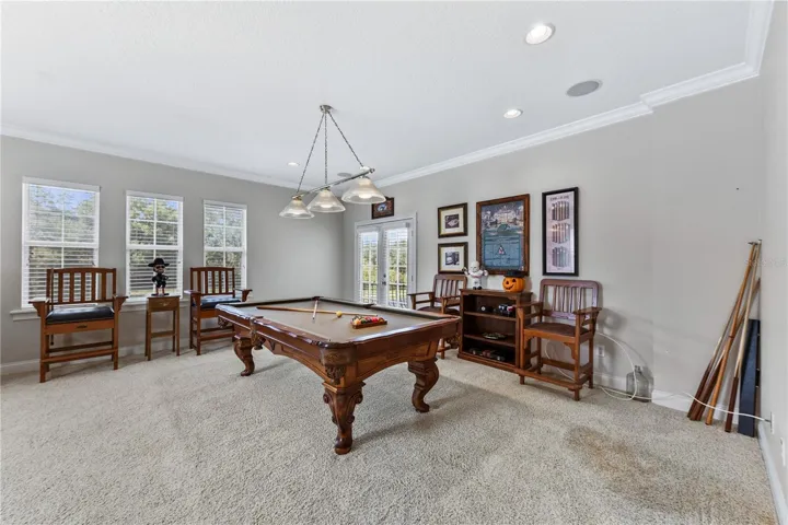 GAME ROOM W FRENCH DOORS TO BALCONY