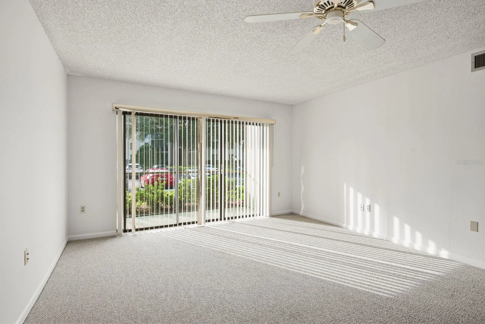 Sliding Doors Lead to Screened Patio