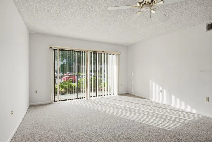 Sliding Doors Lead to Screened Patio