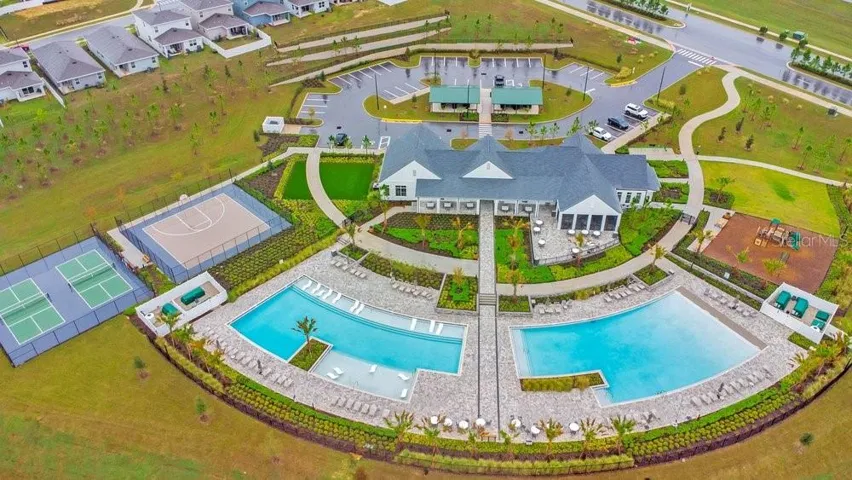 Incredible new Amenities Center with 2 resort style pools, playground, dogpark, pickleball courts, fitness center, and indoor and outdoor kitchens