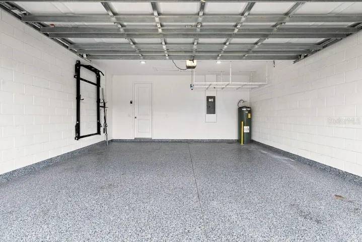Garage with Epoxy Floors, shelf, and power rack