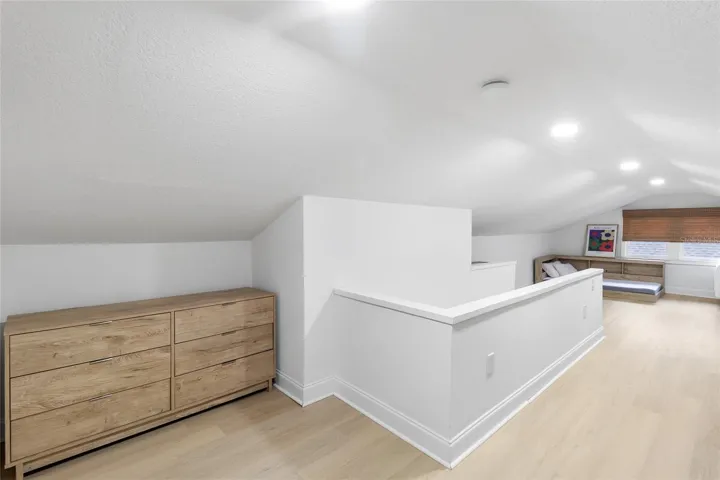 Upstairs loft bedroom! Recessed lighting! LVP floors and closet too!