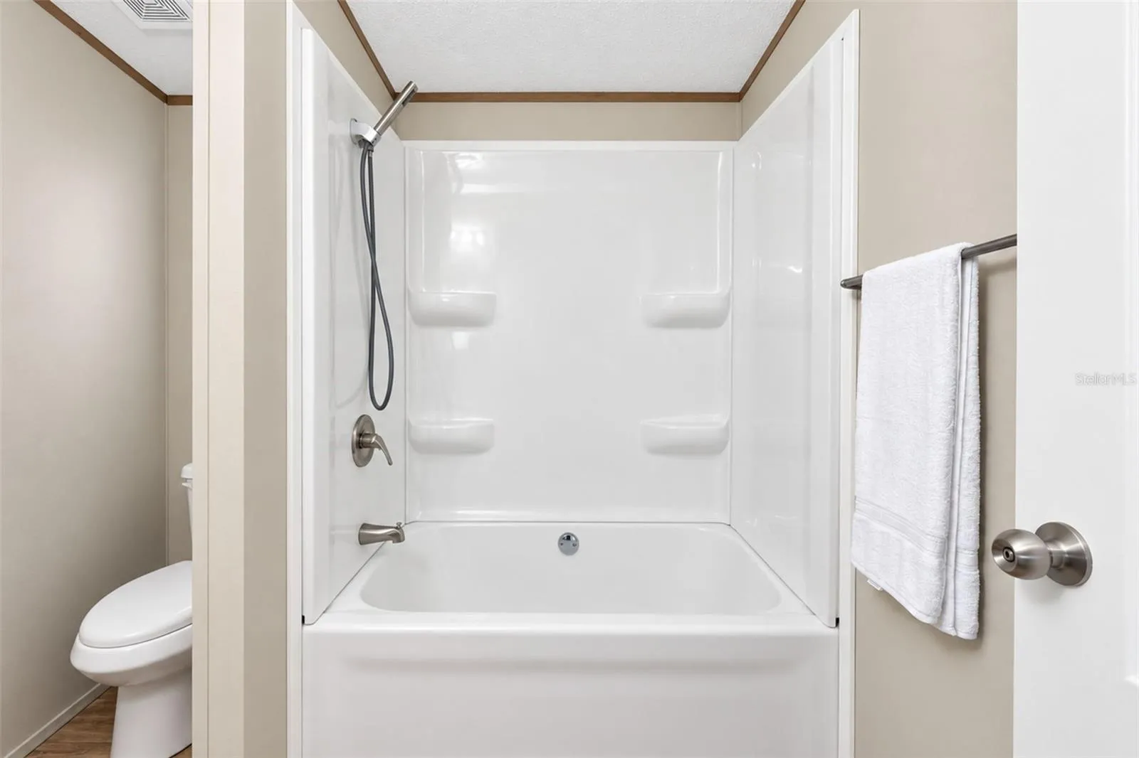 Guest bath features a combo tub/shower