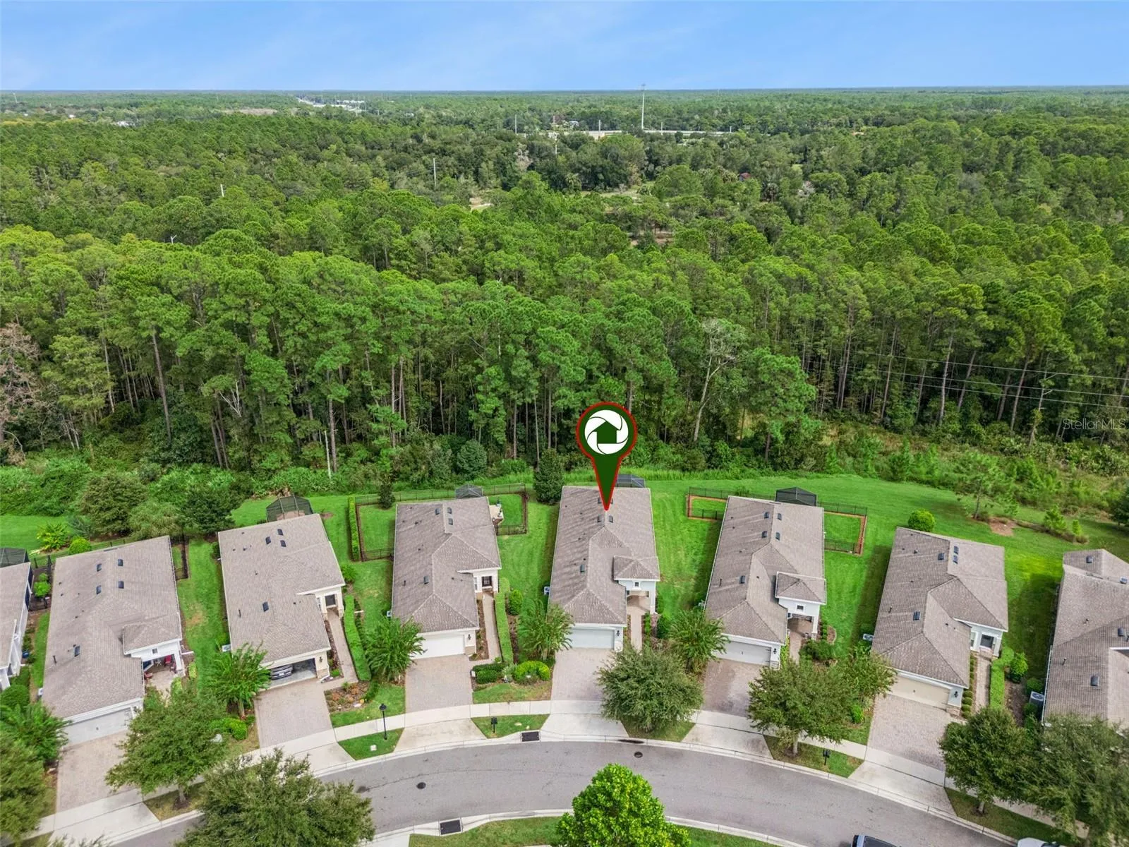 Aerial view of the Home's location w/ a conservation area view