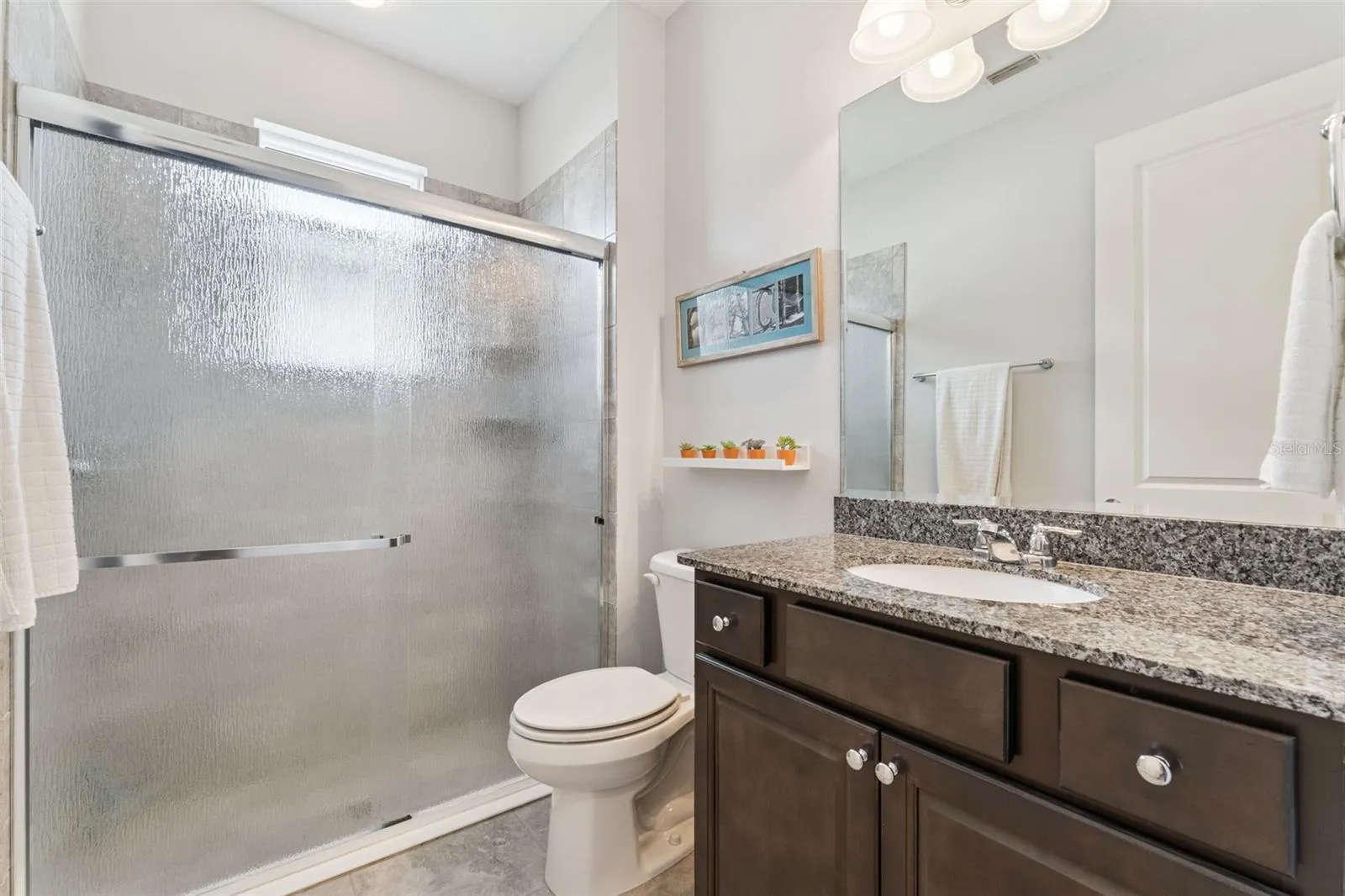 9' x 5'6" Guest Bathroom w/ walk-in shower &amp; sliding glass door