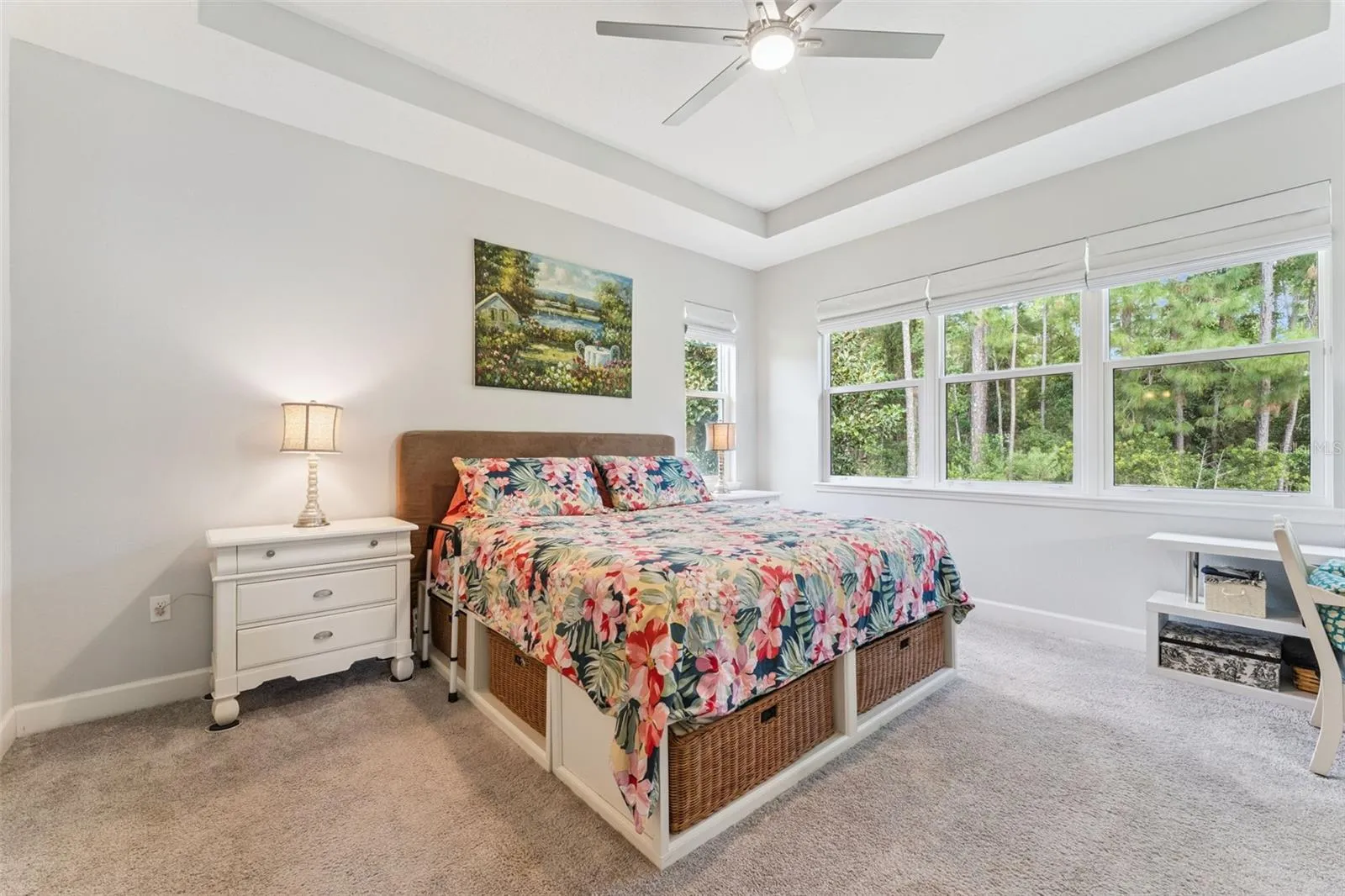 13' x 15' Primary Bedroom w/ tray ceiling, ceiling fan, pull-down shades &amp; a conservation area view