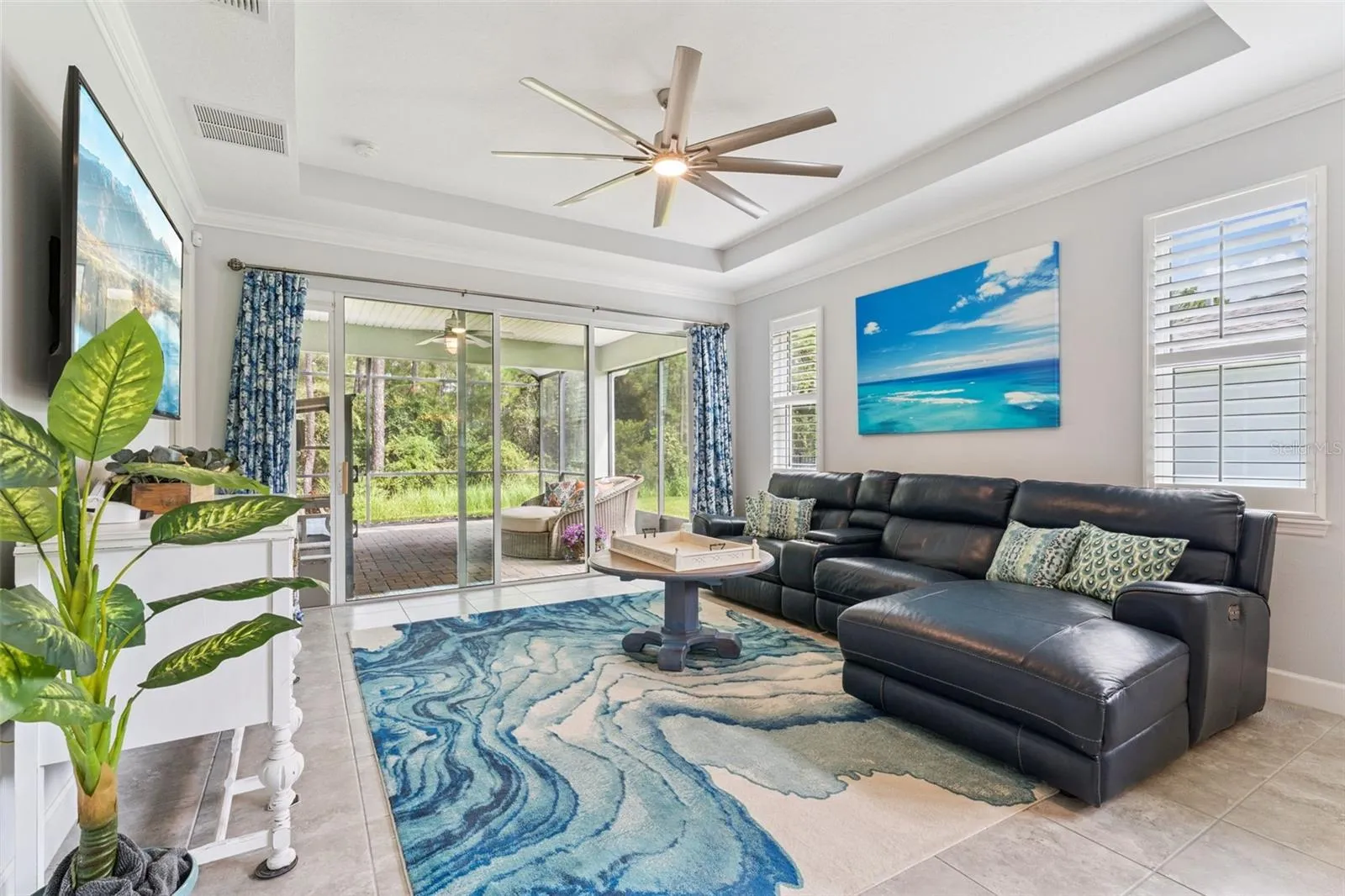 15' x 15' Great Room w/ Plantation style shutters &amp; a conservation area view