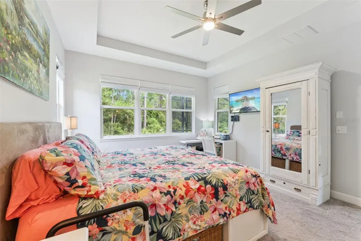 Primary Bedroom w/ a conservation area view