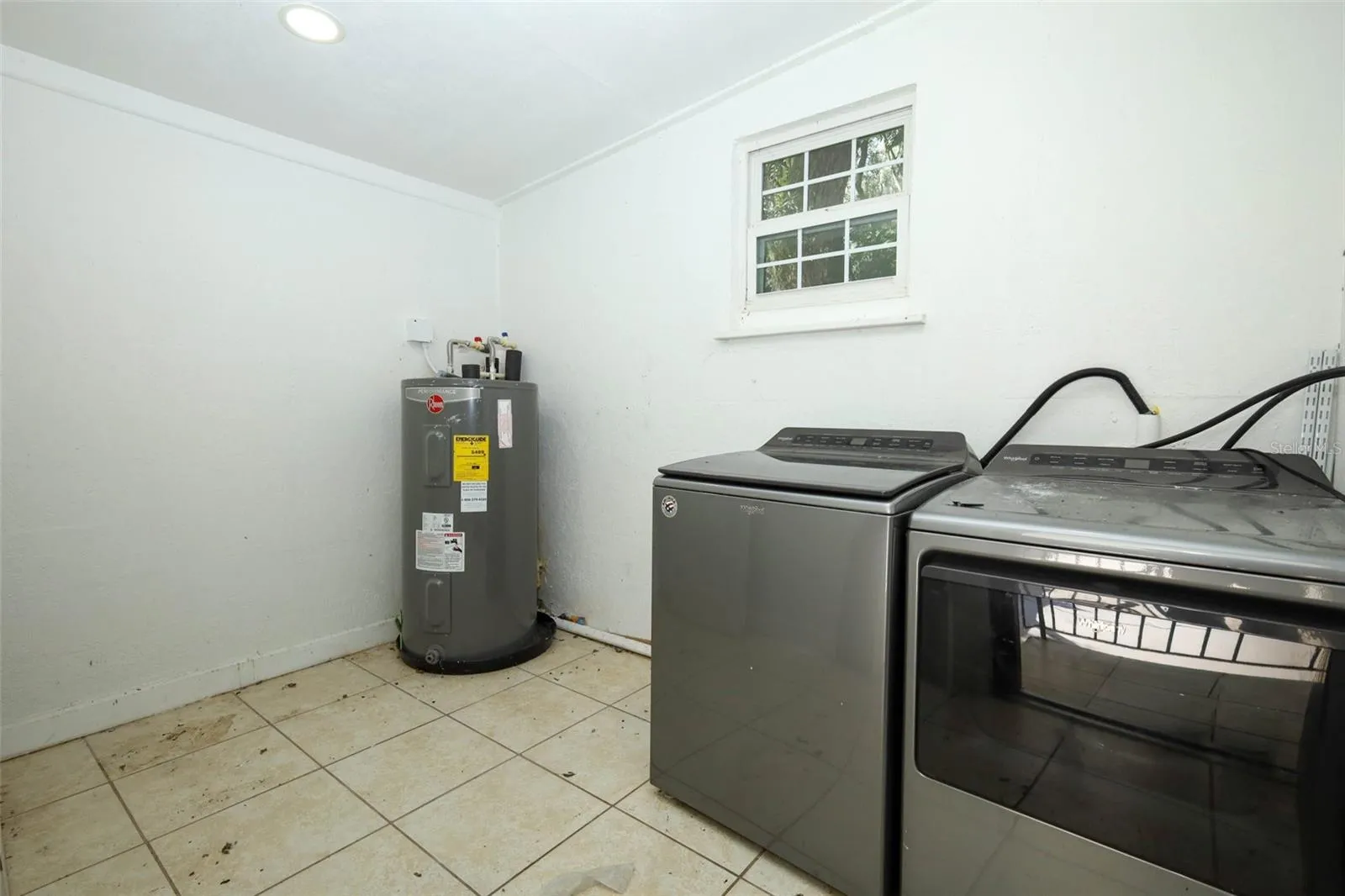 utility room behind carport